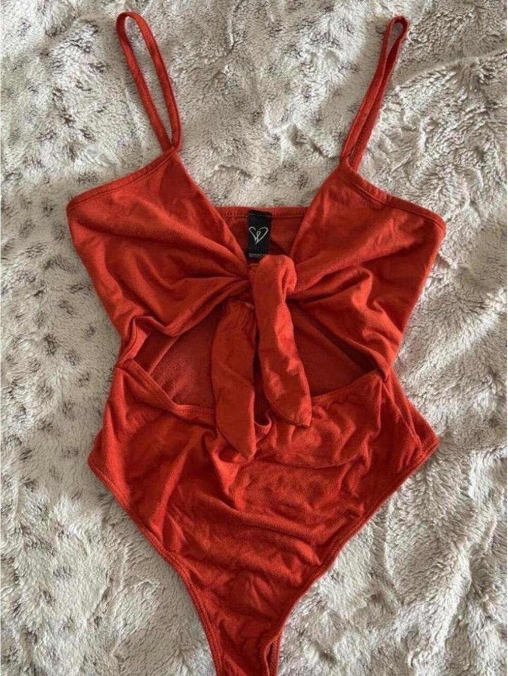 blood orange one piece bodysuit with tie front detail
